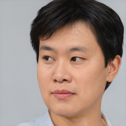 Neutral asian young-adult male with short  brown hair and brown eyes