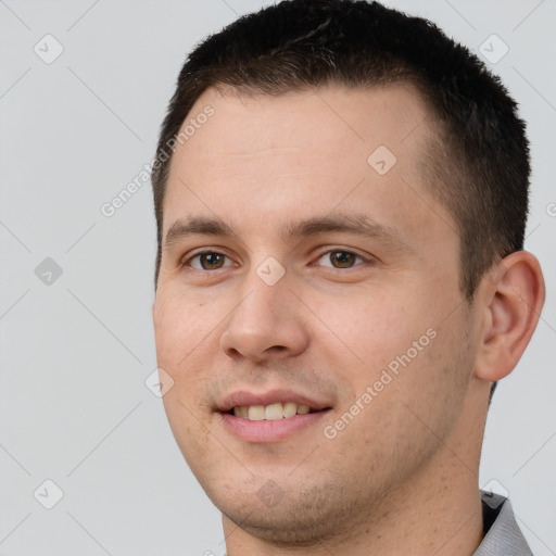 Joyful white young-adult male with short  brown hair and brown eyes