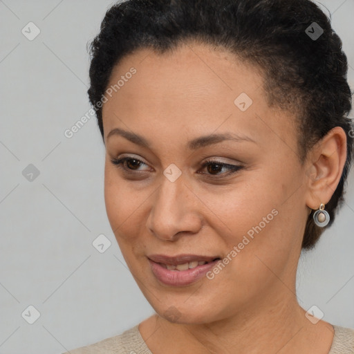 Joyful latino young-adult female with short  brown hair and brown eyes