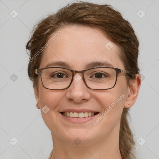 Joyful white adult female with long  brown hair and green eyes