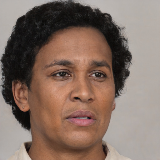 Neutral black adult male with short  brown hair and brown eyes