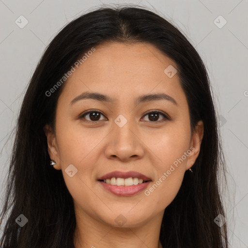 Joyful latino young-adult female with long  brown hair and brown eyes