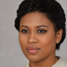 Joyful black young-adult female with short  black hair and brown eyes