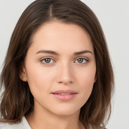 Neutral white young-adult female with long  brown hair and brown eyes