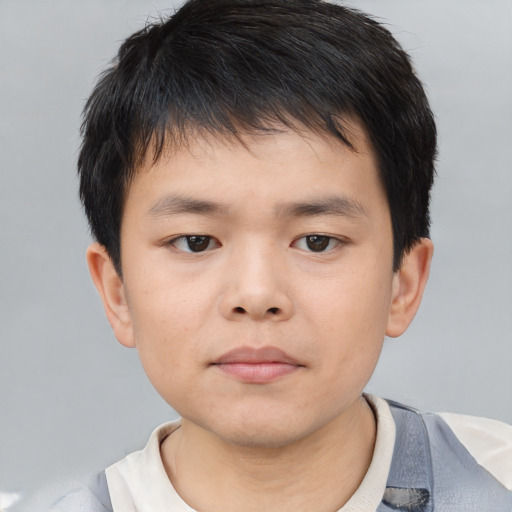 Neutral asian child male with short  brown hair and brown eyes