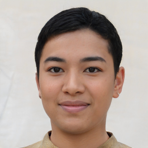 Joyful asian young-adult male with short  black hair and brown eyes