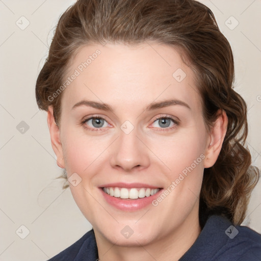 Joyful white young-adult female with medium  brown hair and blue eyes