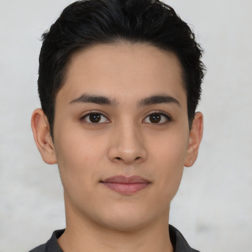 Joyful latino young-adult male with short  black hair and brown eyes