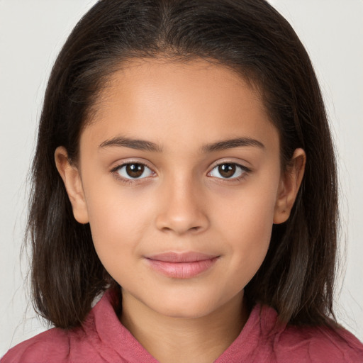 Joyful white child female with long  brown hair and brown eyes