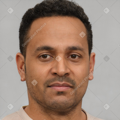Neutral latino young-adult male with short  brown hair and brown eyes