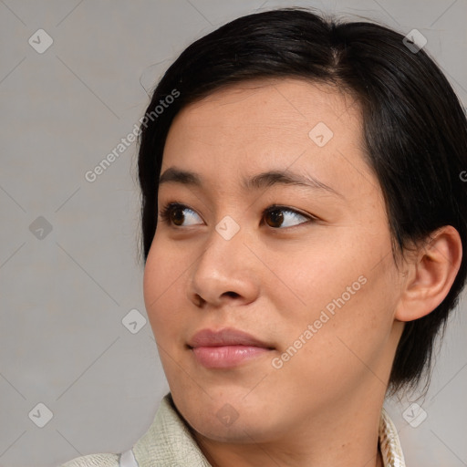 Neutral asian young-adult female with medium  brown hair and brown eyes