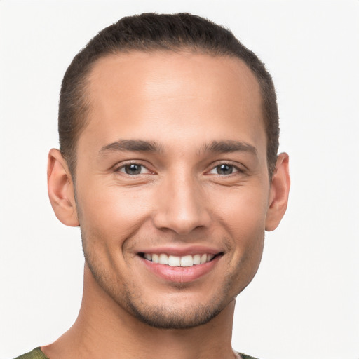 Joyful white young-adult male with short  brown hair and brown eyes