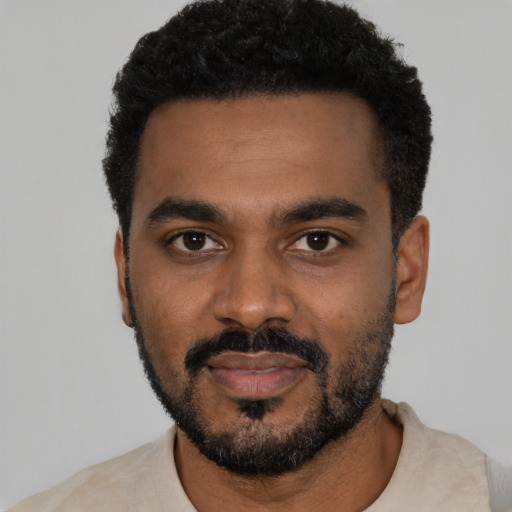 Neutral black young-adult male with short  black hair and brown eyes