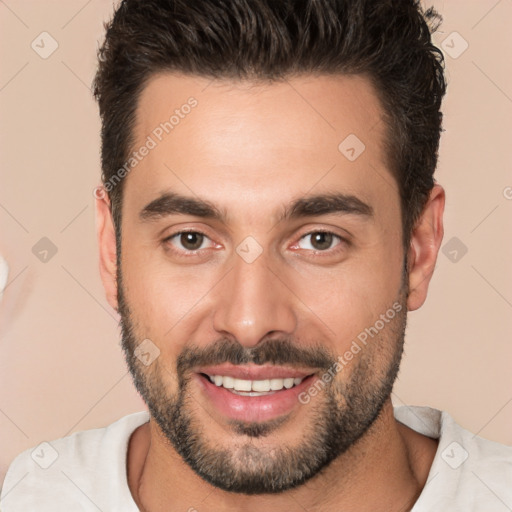 Joyful white young-adult male with short  brown hair and brown eyes