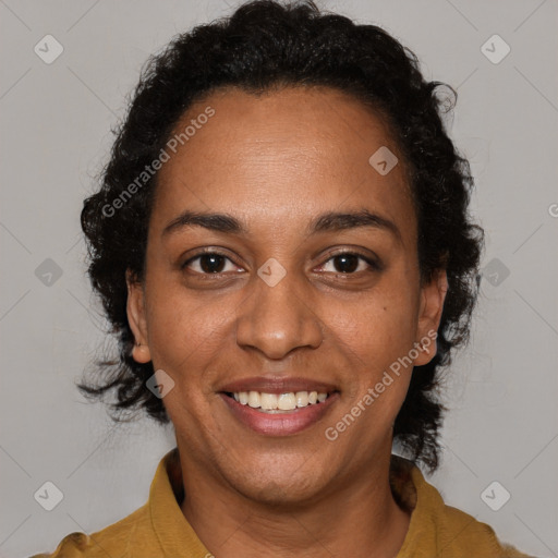 Joyful black adult female with short  brown hair and brown eyes