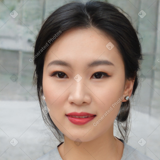 Joyful asian young-adult female with medium  black hair and brown eyes