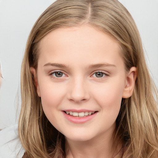 Joyful white child female with long  brown hair and brown eyes