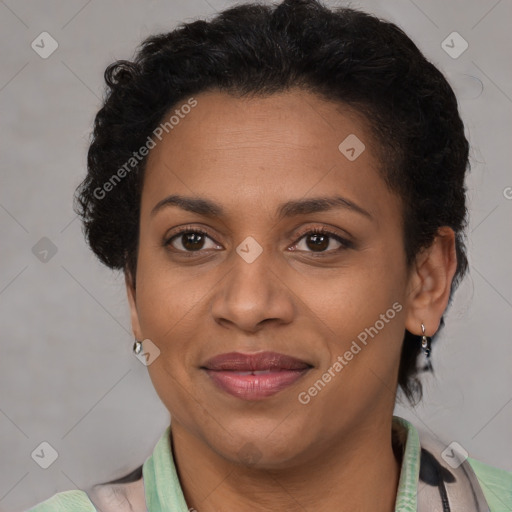 Joyful latino adult female with short  brown hair and brown eyes