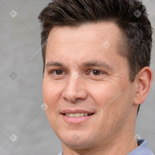 Joyful white adult male with short  brown hair and brown eyes