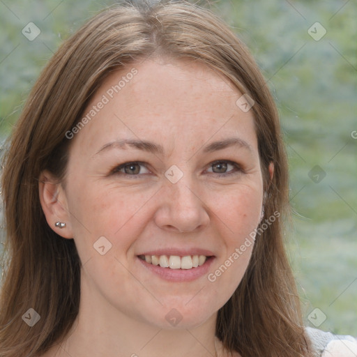 Joyful white adult female with medium  brown hair and brown eyes