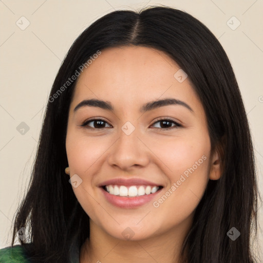 Joyful latino young-adult female with long  black hair and brown eyes