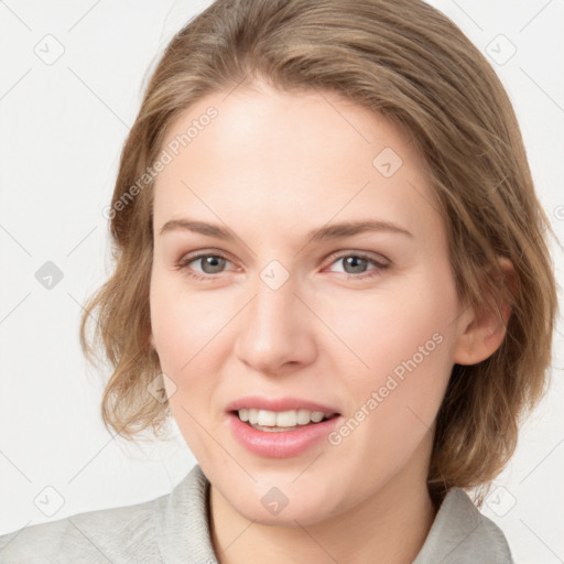 Joyful white young-adult female with medium  brown hair and blue eyes