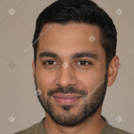 Joyful white young-adult male with short  black hair and brown eyes