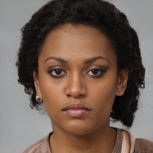 Neutral black young-adult female with short  brown hair and brown eyes