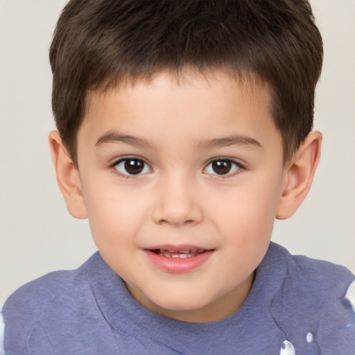 Joyful white child male with short  brown hair and brown eyes