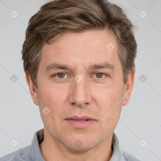 Joyful white adult male with short  brown hair and grey eyes