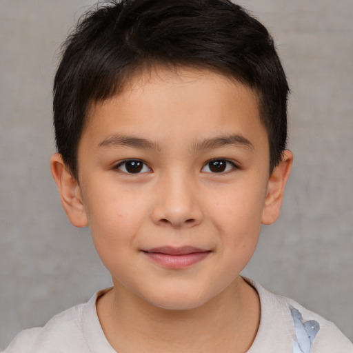 Joyful white child male with short  brown hair and brown eyes