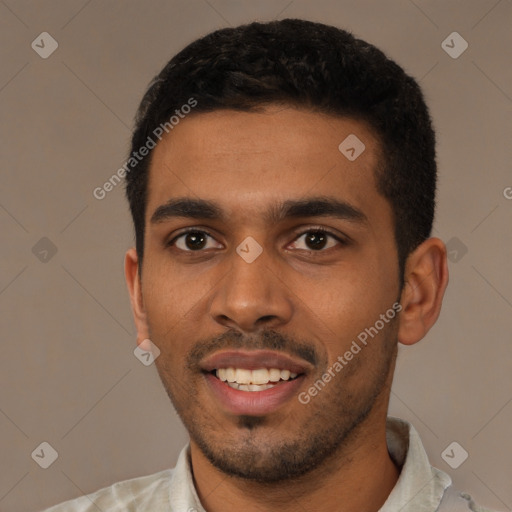 Joyful black young-adult male with short  black hair and brown eyes