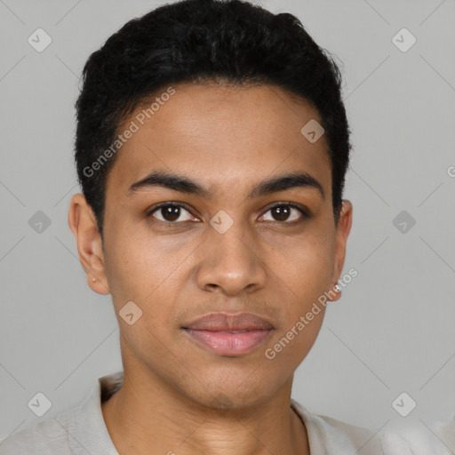 Joyful latino young-adult male with short  brown hair and brown eyes