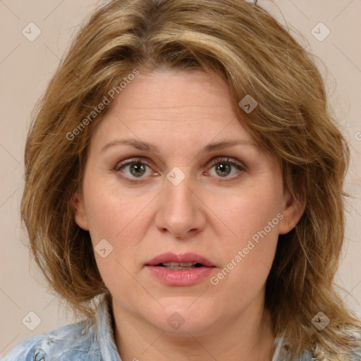 Joyful white adult female with medium  brown hair and blue eyes