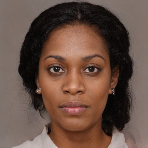 Neutral black young-adult female with medium  black hair and brown eyes