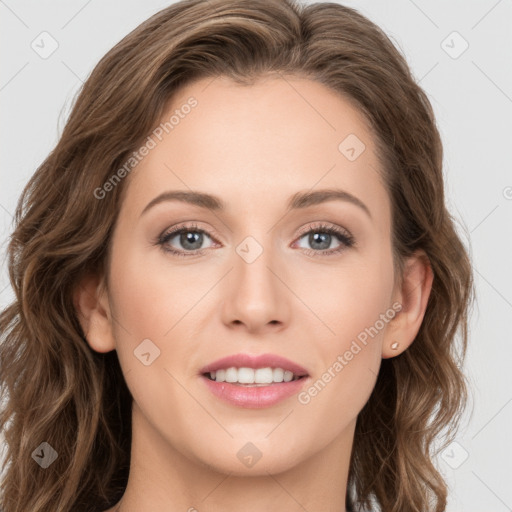 Joyful white young-adult female with long  brown hair and grey eyes