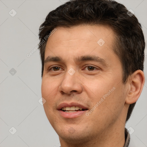 Joyful white young-adult male with short  brown hair and brown eyes