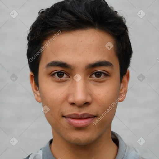 Joyful latino young-adult male with short  brown hair and brown eyes