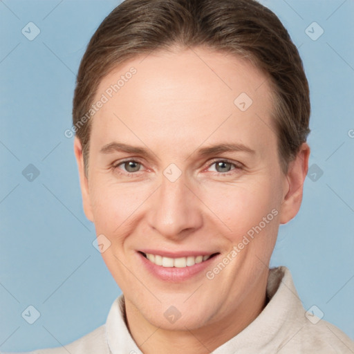 Joyful white adult female with short  brown hair and grey eyes