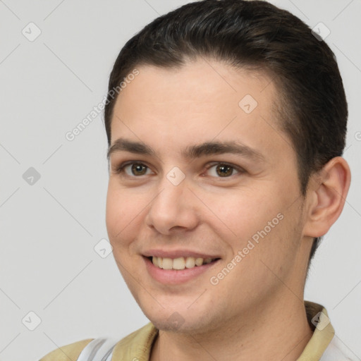 Joyful white young-adult female with short  brown hair and brown eyes