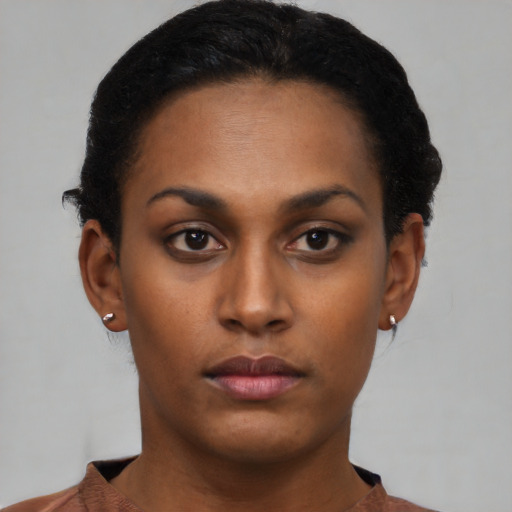 Neutral latino young-adult female with short  black hair and brown eyes