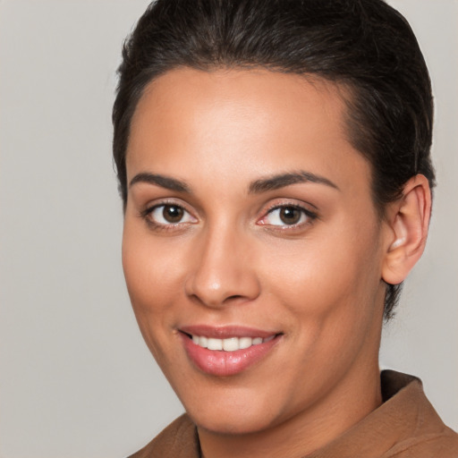 Joyful white young-adult female with short  brown hair and brown eyes