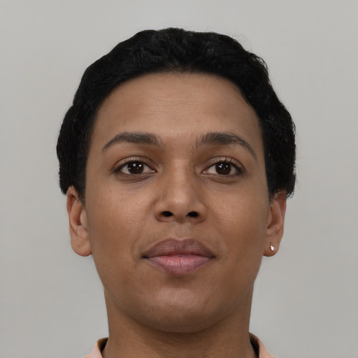 Joyful latino young-adult female with short  black hair and brown eyes