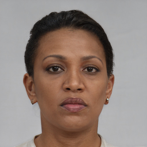 Neutral black adult female with short  brown hair and brown eyes