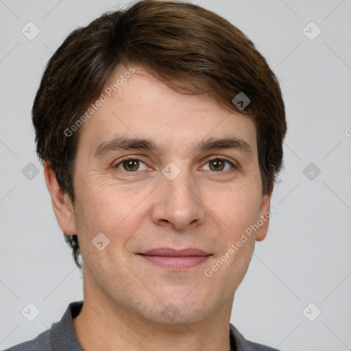 Joyful white adult male with short  brown hair and grey eyes