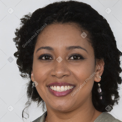 Joyful black young-adult female with medium  brown hair and brown eyes