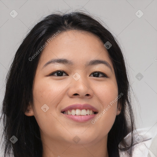 Joyful asian young-adult female with long  brown hair and brown eyes