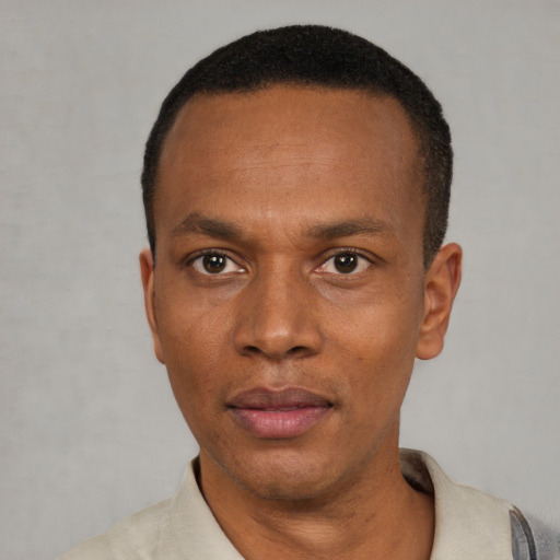 Neutral black adult male with short  black hair and brown eyes