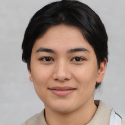 Joyful asian young-adult female with short  black hair and brown eyes