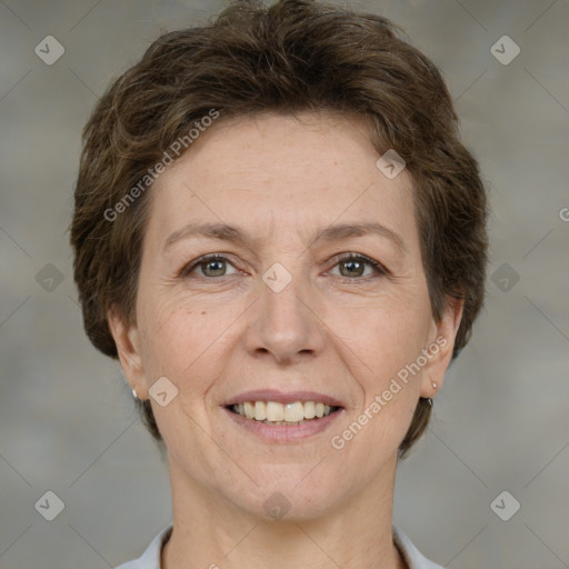 Joyful white adult female with short  brown hair and brown eyes